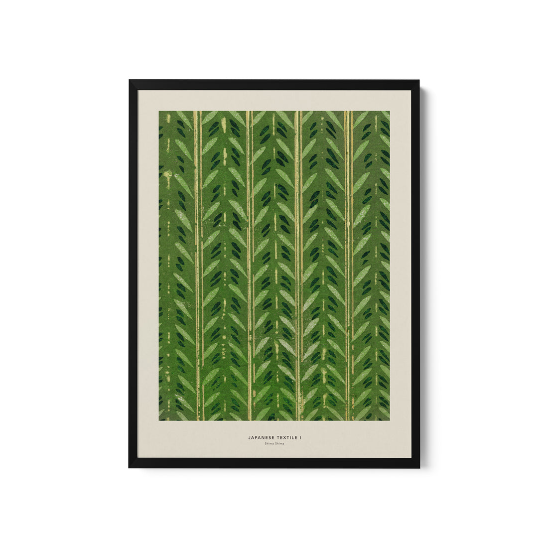 a green leaf print hanging on a wall