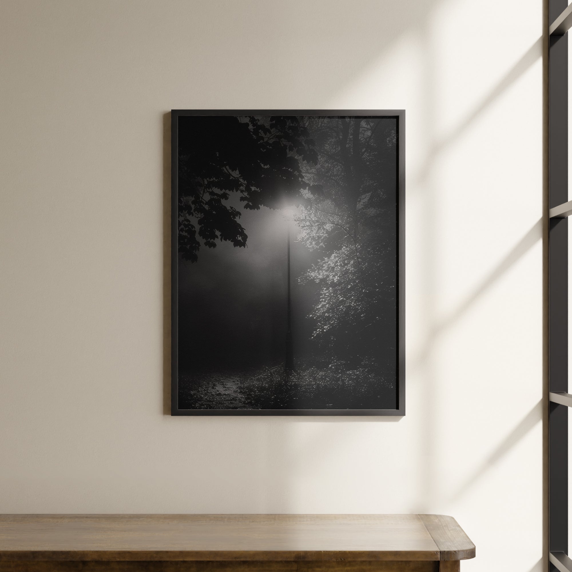 a black and white photo of a tree in a foggy forest