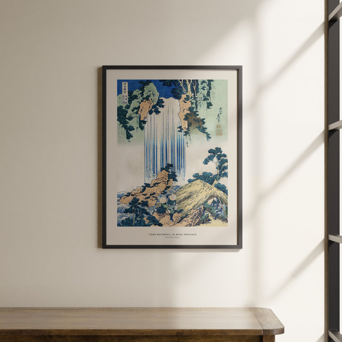 a picture of a waterfall hanging on a wall