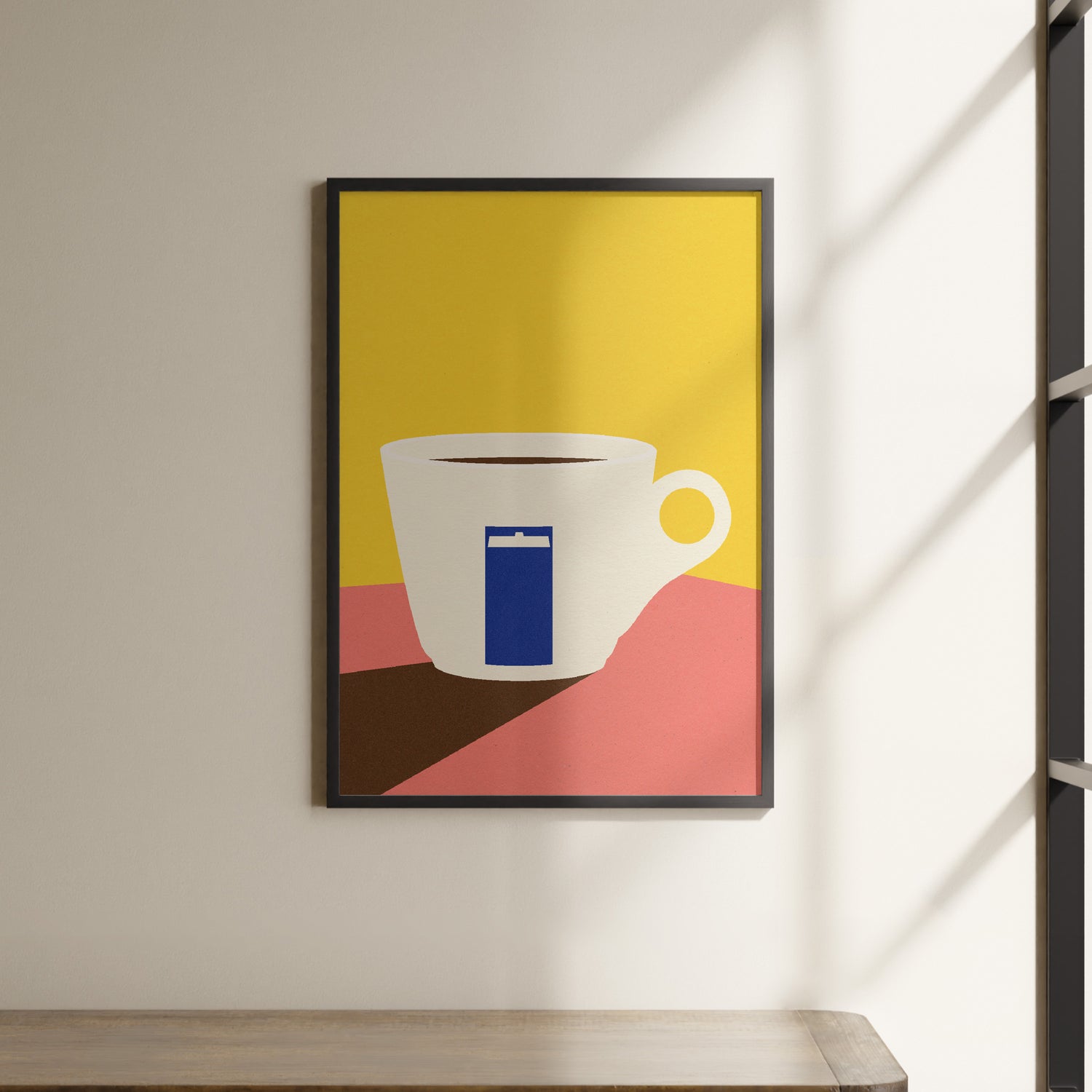 a picture of a coffee cup hanging on a wall