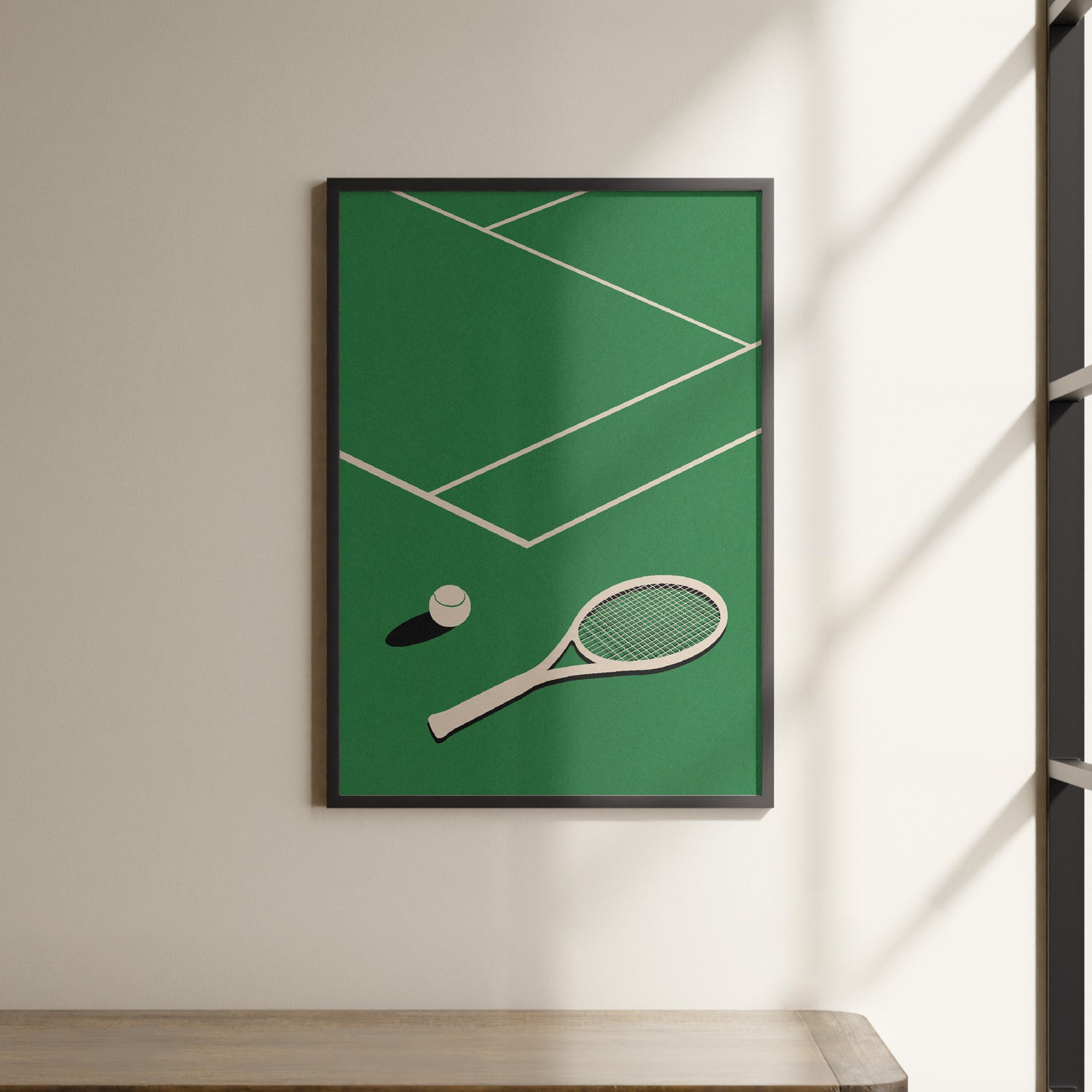 a picture of a tennis racket and ball hanging on a wall