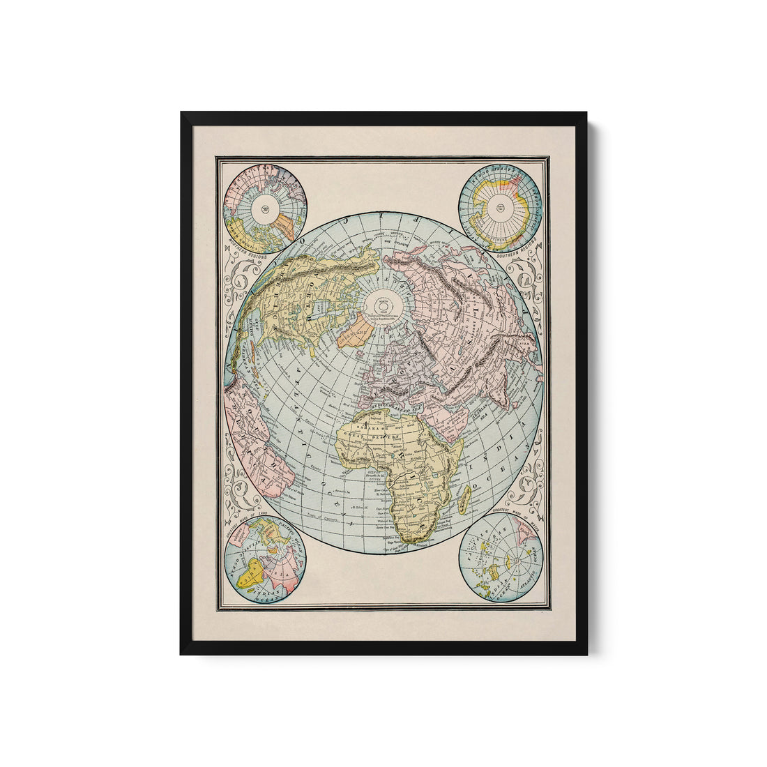 a framed map of the world on a white wall