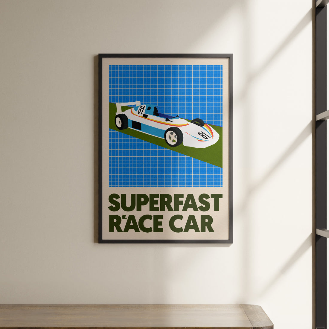 a picture of a race car hanging on a wall