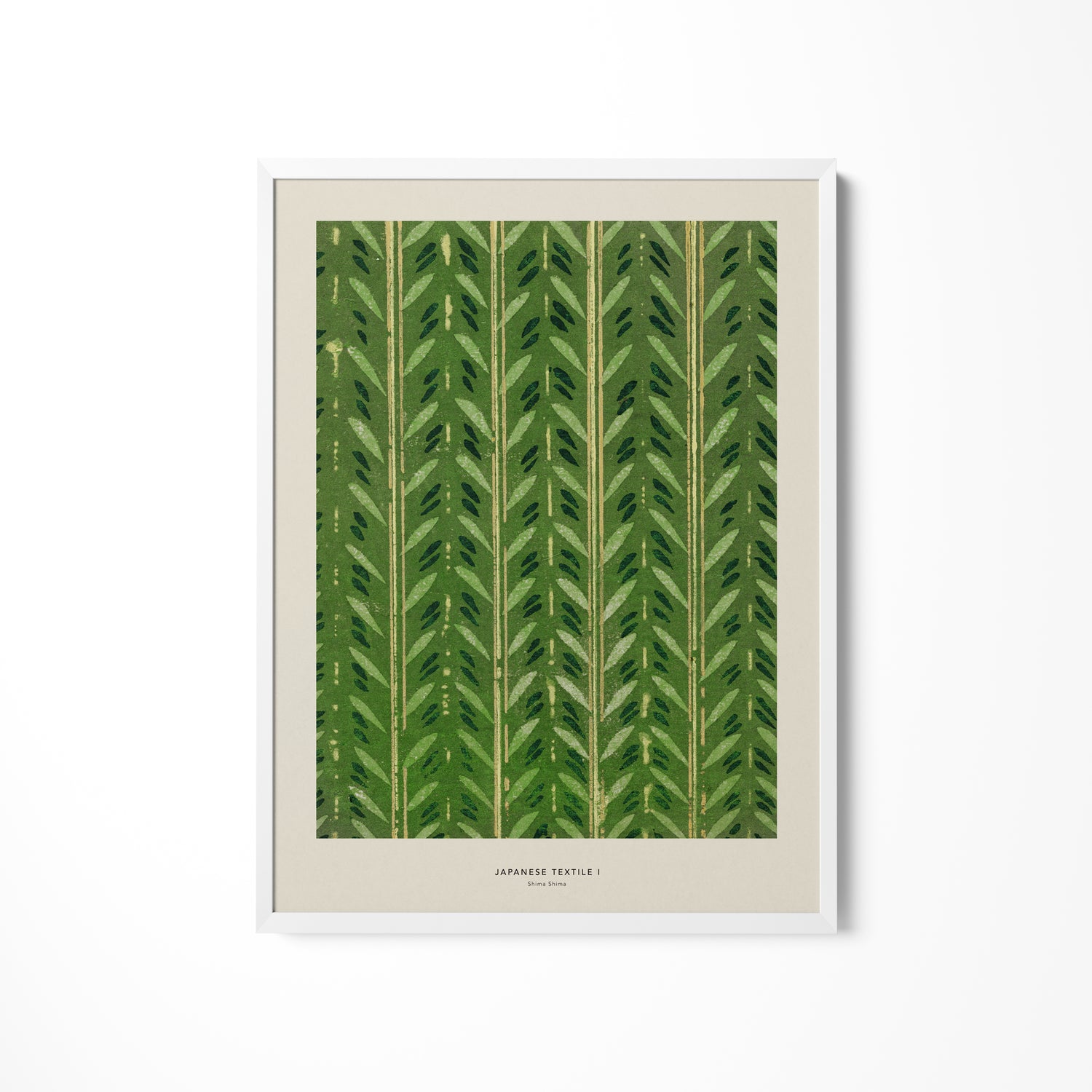 a green leaf print hanging on a wall