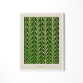 a green leaf print hanging on a wall