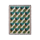 a green, black, and white rug with a geometric design