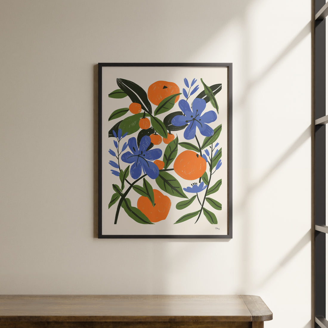 a picture of an oranges and blue flowers on a white wall