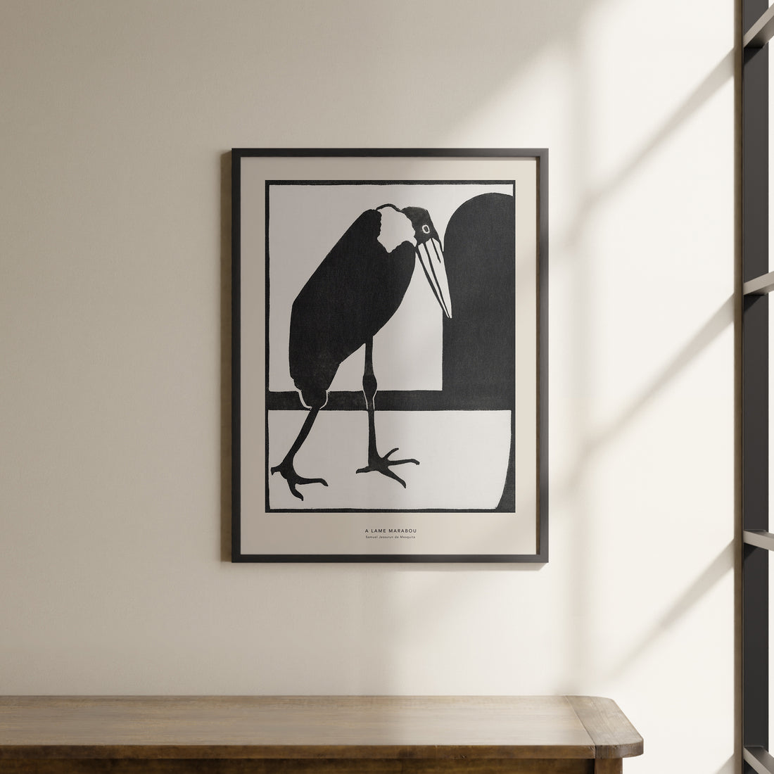 a picture of a bird hanging on a wall