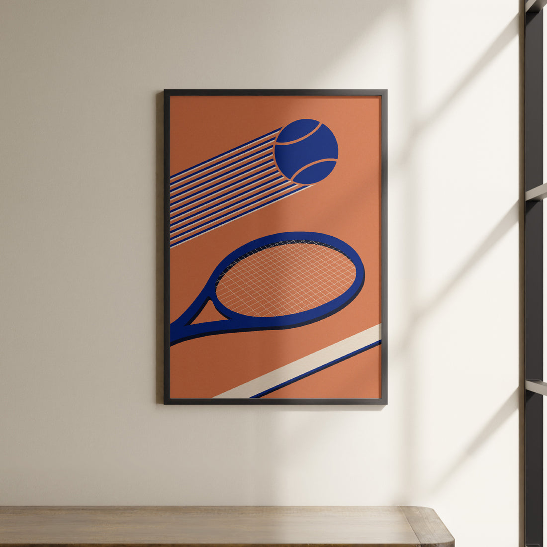 a picture of a tennis racket and ball hanging on a wall