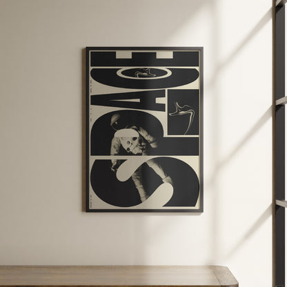 a black and white poster hanging on a wall