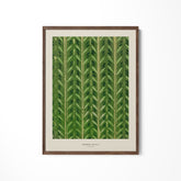 a green leaf print hanging on a wall